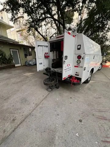 Magnet Plumbing service vehicle on-site for Grease Trap Cleaning in Generations